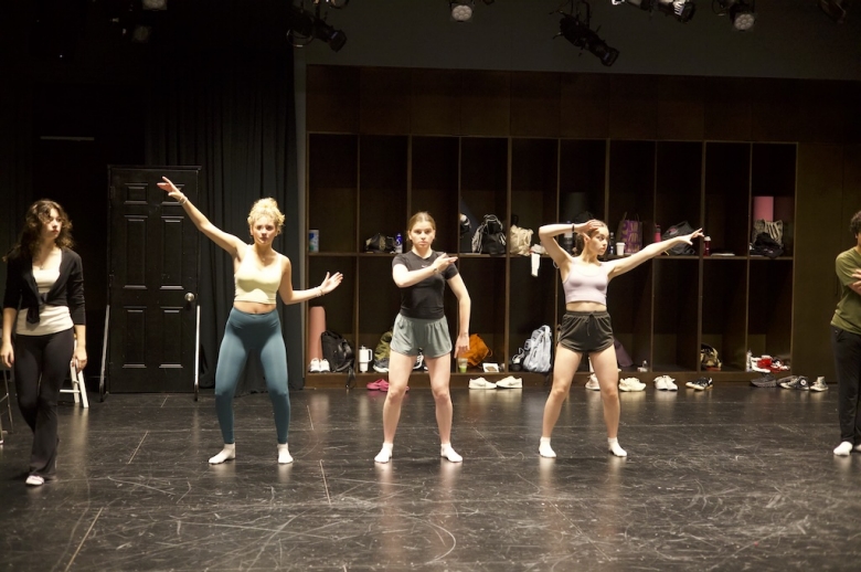 Three Tisch Summer High School Drama students face the camera with arms posed to their side in mid-practice in mid-practice in a drama studio